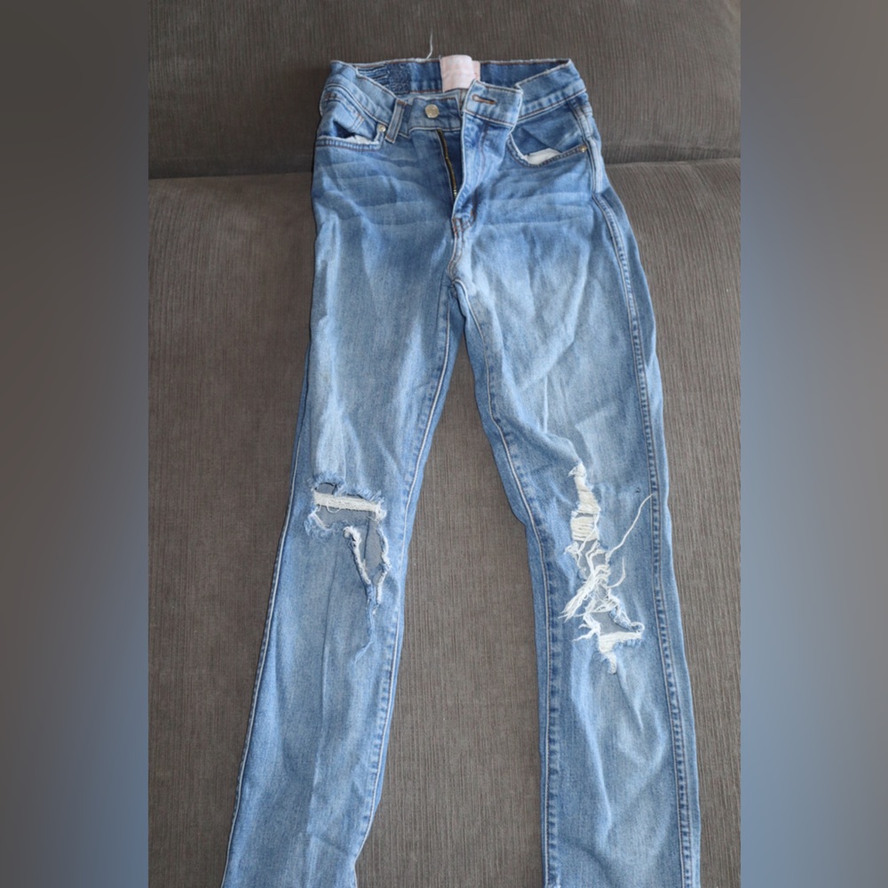 Distressed and ripped Revice Denim Straight Jeans. Has rip under butt